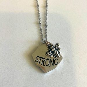 “Be Strong” silver pendant necklace; 18”-20” in length